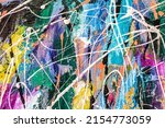 abstract painted canvas background with multicolored paint splashes and blots