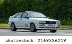 Small photo of Bicester,Oxon,UK - June 19th 2022. 1985 Audi Quattro car driving on an English country road