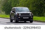 Small photo of Stony Stratford,Bucks,UK - April 30th 2023. 2015 black JEEP RENEGADE travelling on an English country road.