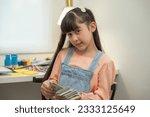 Small photo of Exuding wealth and affluence, a rich girl confidently holds a substantial amount of money in her hand, showcasing her opulent lifestyle.