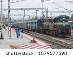 Small photo of Pondicherry, India - March 17, 2018: Goats on the railroad station watching the comings and goings of travellers and trains. The Indian rail network covers 75,000 miles, carrying 23m passengers daily