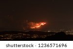 Small photo of Firestorm Fire and clouds Woolsey Fire Hill in Los Angeles Malibu California Post Apocalyptic