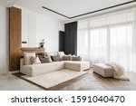 Elegant and comfortable designed living room with big corner sofa, wooden floor and big windows