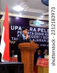 Small photo of Central Java, Indonesia - Mei 15, 2023 : someone giving a speech at the graduation ceremony for SMAN 1 SOKARAJA students on Mei 15