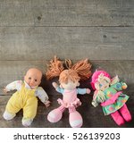 Dolls On Wooden Background. Top ...