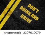 Small photo of Don't Drink and Drive written on the road,Lane with the text Dont drink and drive
