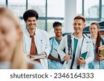 Small photo of Happy multiracial medical students going to a lecture at the university amphitheater.