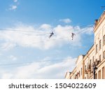 Small photo of MOSCOW, RUSSIA - September 07, 2019. Two funambulists over Tverskaya street. Street festival and different leisure activities on Moscow Day celebration.