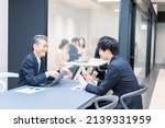 Small photo of Boss and subordinate having a meeting