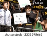 Small photo of AI is Soulless sign at sag aftra picket line at Rockefeller Center on July 17, 2023.