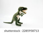 Small photo of Tyrannosaurus or trex dinosaur toy in green