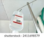 Small photo of Sape, Indonesia - January 9, 2024: Hanging Ringer Lactate Saline Infusion Intravena Drip at the Hospital