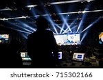 Silhouette of worker control, sound system and lighting in concert.