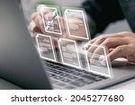 Small photo of Businessman working on laptop computer with electronics document icons, E-document management, online documentation database, paperless office concept