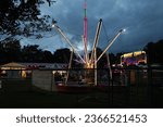 Small photo of Syston, Leicestershire, England, September 19th 2023, Billy Bates fun fair and amusement park, Central Park, taken at dusk