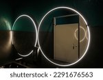 Large round mirror with lights in a downtown bar restroom 