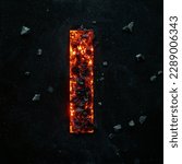 Small photo of A photo of a burning capital letter I on a black background is made of hot coals.