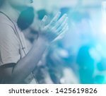 Man praying and worship to GOD in Church.Man raised hands and pray to GOD.Hand praying and palmup,Concept Praise and worship with faith, spirituality and Surrender.