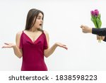 Small photo of Human emotions and feelings. Lovely female is confused to get the zilch sign instead of flowers from her man.