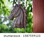 Small photo of This object is installed in front of a barn. He personifies a beautiful animal. It's a kind of moving mobile. Ulverton, Quebec, Canada; June 20, 2019.