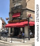 Small photo of Paris France July 2018. Popular local brasserie ideal corner location with sidewalk tables for steady clientele near Musee Antoine Bourdin and trains at Gare Montparnasse