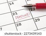 Deadline reminder written on calendar in red marker