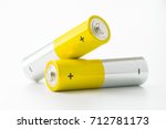 Two yellow AA size batteries isolated on white backgraound