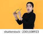 Small photo of Scared and Surprised Young Indian Lady Holding Spectacles - Fear, Shock, Terror, Unease - Tense Girl in Panic Looking at Camera