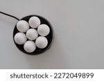 Small photo of Egg cooker or egg boiler with white eggs.