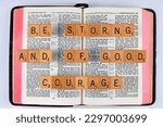 Small photo of Vancouver, BC, Canada - Circa April 2023: Scrabble letters spelling Bible Verse 1 Chronicles 22:13 Be strong and of good courage