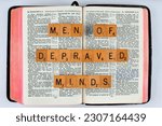 Small photo of Vancouver, BC, Canada - Circa May 2023: Scrabble letters spelling Bible Verse 2 Timothy 3:8 Men of depraved minds