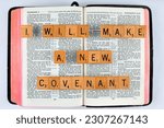 Small photo of Vancouver, BC, Canada - Circa May 2023: Scrabble letters spelling Bible Verse Hebrews 8:8 I will make a new covenant
