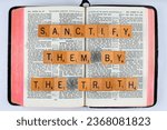 Small photo of Vancouver, BC, Canada - Circa May 2023: Scrabble letters spelling Bible Verse John 17:17 Sanctify them by the truth