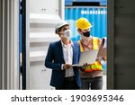 Small photo of Asian businessman and Professional foreman woman work at Container cargo site check up premium goods in container, business Logistics oversea import export shipping industrial import-export transport.
