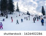 Small photo of Paltinis Arena Platos, Romania - January 11, 2020. Lots of people on a mountain slope at ski resort in Paltinis Arena Platos. Paltinis Arena Platos is a most popular ski resort in Sibiu, Romania