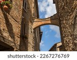 Small photo of Sunnu Italian medieval street in Anghiary with a flying butress connecting the houses