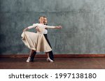 Small photo of Young boy and girl dancers dances at ballroom dance Viennese Waltz.