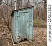 Outhouse in the woods near...