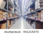 Abstract blur background of inside of warehouse with aisle pallet on high shelf