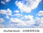 Deep blue skies with white clouds background with space for text,  blue cloudy skies texture, dark blue sky wallpaper with with white fully clouds and sunlight
