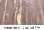 Small photo of Corroded metal background. Rusted metal wall. Rusty metal background with streaks of rust. Red or yellow Rust stain. Metal surface rusted spots