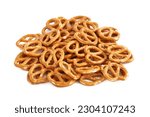 Small photo of mini salted pretzel isolated on white background. mini salted cracker pretzel isolated on white background. salty, mini snack, appetizer, pretzel isolated