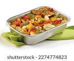 grilled vegetables in an aluminum tray with a green napkin underneath on a white background, bbq, colorful dish mixed vegetables, grilled vegetable salad