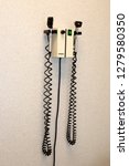 Small photo of MINNEAPOLIS, MINNESOTA USA - MARCH 04, 2016: Welch Allyn integrated diagnostic center wall mounted otoscope & ophthalmoscope in doctors office.