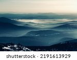 Small photo of Colorful mountain hills with tonal perspective at winter evening at sunset. Abstract panoramic landscape in Gornaya Shoria, Sheregesh ski resort in Russia Foggy Mountains nature environment background