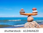Concept of harmony and balance. Balance stones against the sea. Rock zen in the form of scales