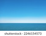 Horizon line, blue sky and blue sea. Drone view. Abstract natural background.