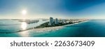 Small photo of wide drone shot of the port of miami florida during a bright sunny day. Miami Beach, wonderful aerial view of buildings, river and vegetation. Panorama view of Miami Beach, South Beach, Florida, USA.