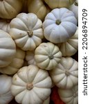 Small White Pumpkins Stacked...