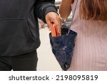 Small photo of Beware of pickpockets, Please check your belonging before leaving, be careful, bag robber, man robbed woman, Thief stealing in public. hijack concept